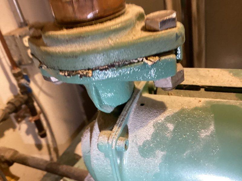 Responded to service call for boiler safety inspection and water coil replacement. Upon inspection, identified severely corroded and rusted-through water coil with visible oxidation and verdigris formation on copper piping and fittings. Removed failed water coil and replaced with new unit. Inspected heat exchanger for safety concerns and verified proper operation. Secured all plumbing connections and tested system for leaks. System restored to full operational status.