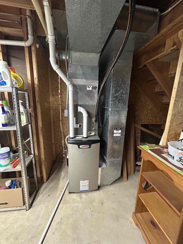 Completed scheduled preventive maintenance tune-up on residential Lennox furnace system located in basement utility area. Performed comprehensive inspection of heating unit, ductwork connections, and PVC venting system per manufacturer specifications. No issues or deficiencies were identified during inspection, and all system components were found operating within normal parameters.