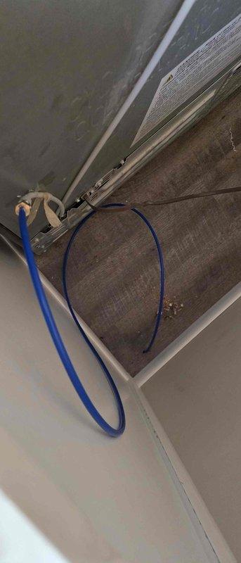 Responded to a water leak at the refrigerator supply line. Upon inspection, identified a broken refrigerator water line as the source of the leak. Removed the damaged line and installed a new refrigerator water supply line, restoring proper water flow to the appliance. Provided estimate for future plumbing work involving disconnect and reconnect of fixtures under the kitchen sink.