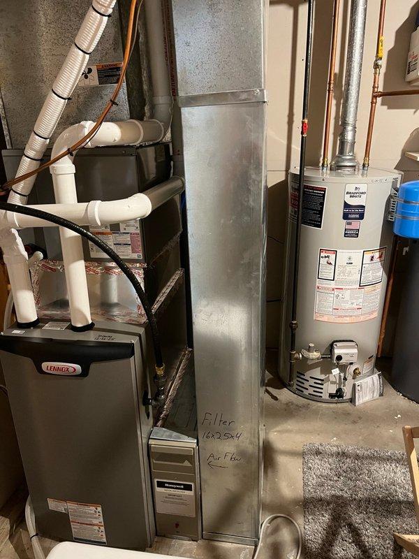 Completed comprehensive AC tune-up on 27-year-old unit, finding a heavily soiled filter while blower and evaporator coil remained clean with proper drainage. Electrical inspection of outdoor unit revealed capacitor reading 32 µF on compressor side, below the rated 35 µF specification, while all other components tested within normal parameters and condenser coil was clean. System operated successfully for 15 minutes with over 15° temperature split; provided estimate for capacitor replacement per homeowner's request.