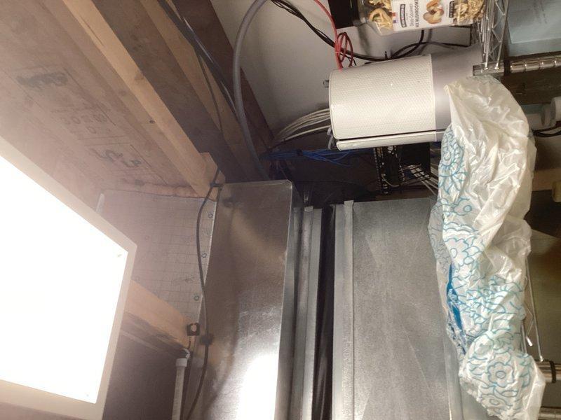 Responded to report of water dripping from round ductwork serving the second floor. Used inspection camera to thoroughly examine the interior of the ductwork and found no evidence of water stains, rust, or moisture damage inside the duct system. Conducted external inspection of the ductwork and observed water marks running down the exterior surface. Determined the issue to be condensation forming on the outside of the duct as it runs through an uninsulated chase from the garage area. Recommended insulating the space around the ductwork in the chase to eliminate the temperature differential causing condensation buildup.