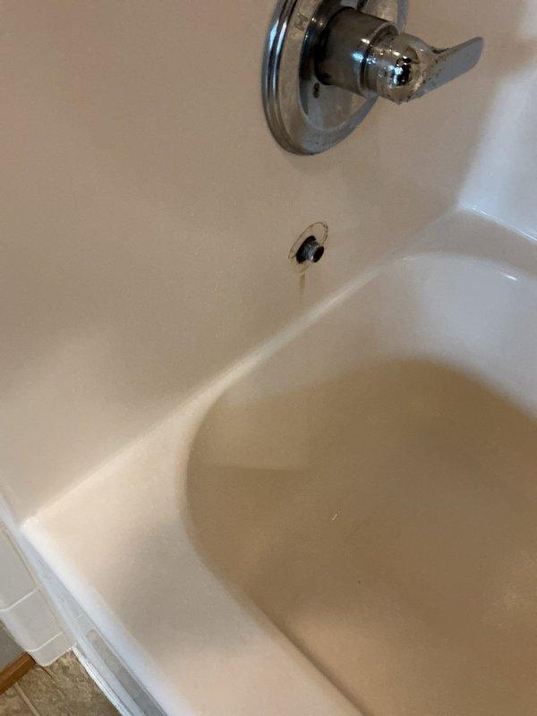 Responded to service call for low water pressure in shower and stuck lavatory strainer. Removed and cleaned clogged flow restrictor from shower head, restoring proper water pressure. Replaced stuck lavatory strainer with new unit to restore proper drain function. Addressed bathtub diverter malfunction preventing switching from tub spout to shower mode, completing all necessary repairs to restore full functionality of bathroom fixtures.