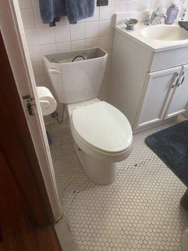 Responded to service call addressing multiple plumbing issues identified during home inspection. Repaired water leak at main supply pipe above meter near basement ceiling using compression fittings on copper piping. Evaluated and serviced basement laundry sink faucet experiencing difficulty with operation, performing necessary adjustments to restore proper function. Inspected upstairs toilet exhibiting instability and rocking motion, assessed mounting and wax ring condition. Documented existing plumbing infrastructure with photographic evidence showing copper supply lines and bathroom fixtures. Work performed in accordance with Minneapolis municipal code requirements for licensed plumbing contractors, with permit coordination initiated for required safety inspections and final approval.