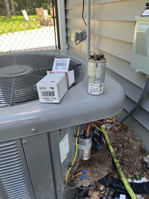 Responded to no cooling callback and found indoor unit operating properly with good airflow, but outdoor condenser completely non-functional. Diagnosed failed dual-run capacitor (40/5 MFD) with failure on both common and fan terminals. Condenser fan motor exhibited elevated temperature and increased bearing resistance, indicating imminent failure. Replaced faulty capacitor and verified system operation with all components functioning correctly. Advised customer that fan motor shows signs of deterioration and recommended obtaining estimate for motor replacement, as current repair serves as temporary solution. Customer approved continuation of service with existing motor and agreed to pursue future motor replacement estimate.