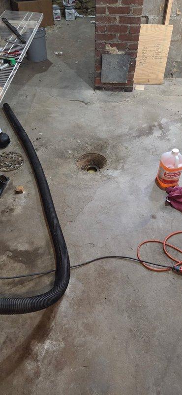 Responded to sewer backup emergency call. Upon arrival, confirmed main sewer line was backing up into the property. Accessed the sewer cleanout located in the garage area. Deployed large Ridgid cable machine to clear the blockage. Successfully augered through the obstruction and restored proper drainage flow. Tested system to verify complete clearance of the line. Sewer is now draining properly with no further backup issues.