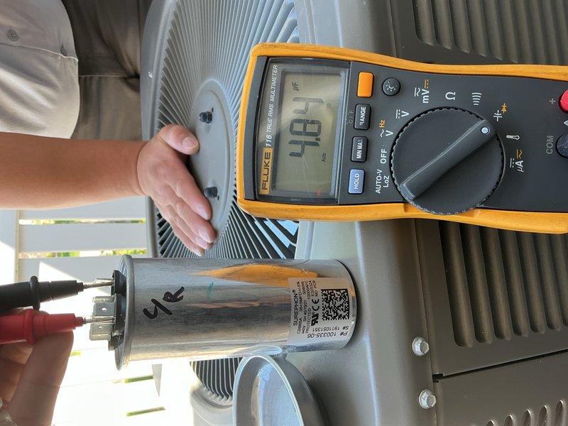 Responded to no cooling complaint with loud noise from outdoor unit. Upon arrival, found 6-year-old system with no previous maintenance history and outdoor coil heavily restricted with cottonwood debris, which property owner had recently cleaned. Inspected air filter and found it loaded with dust and particulate accumulation. Tested capacitor with multimeter, reading 48.7 μF, which was within acceptable range. Verified contactor and condenser fan motor operation—both functioning properly. Performed refrigerant pressure and temperature analysis: low side pressure 193 PSI with 17°F superheat and 67°F saturated temperature; high side pressure 270 PSI with 14°F subcooling and 88°F saturated temperature. Refrigerant charge levels confirmed adequate. Loud rattling noise persisted during compressor operation despite coil cleaning. Based on diagnostic findings, determined compressor is failing mechanically. Provided estimate for compressor replacement to resolve the issue.