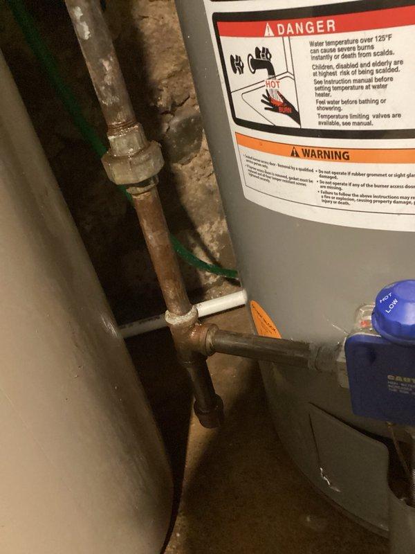 Responded to reported gas leak on water heater control valve nipple as identified by utility company. Upon arrival, restored gas supply and performed comprehensive leak detection testing using soap solution on all gas line fittings, connections, and the control valve nipple. No active gas leaks were detected at any test points. Per customer request due to upcoming relocation and for safety precautions, shut off gas supply to the water heater. Water heater was producing hot water and functioning properly at time of service.