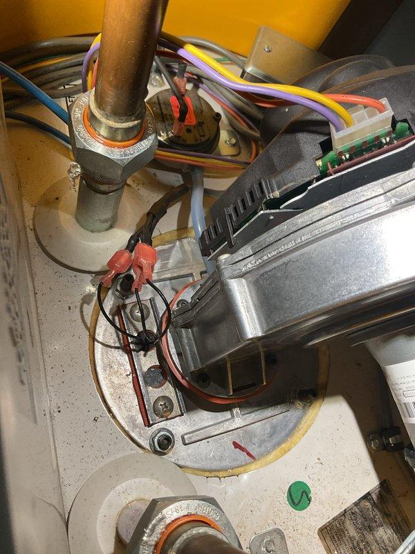 Responded to service call for water heater producing banging noise during operation. Upon inspection, diagnosed failing flame igniter as primary cause of operational issues. Replaced flame igniter, flame sensor, and burner gasket to restore proper combustion and eliminate noise. Discussed unit's overall condition and recommended considering replacement due to age and component wear patterns observed during service.