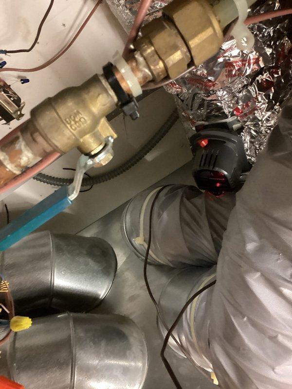 Responded to install callback for compressor and airflow issues. Diagnosed multiple system configuration problems including incorrect Unico fan speed and size settings, refrigerant overcharge, improperly sized TXV, and failed basement zone damper. Consulted with Unico technical support to properly configure fan speeds and system size parameters. Recovered approximately 4 pounds of excess refrigerant to achieve proper system charge. Replaced defective basement zone damper to restore proper airflow distribution. Adjusted TXV settings to establish acceptable superheat levels, as valve appeared undersized for system tonnage and was restricting refrigerant flow. System tested and verified operational with improved airflow and compressor performance.