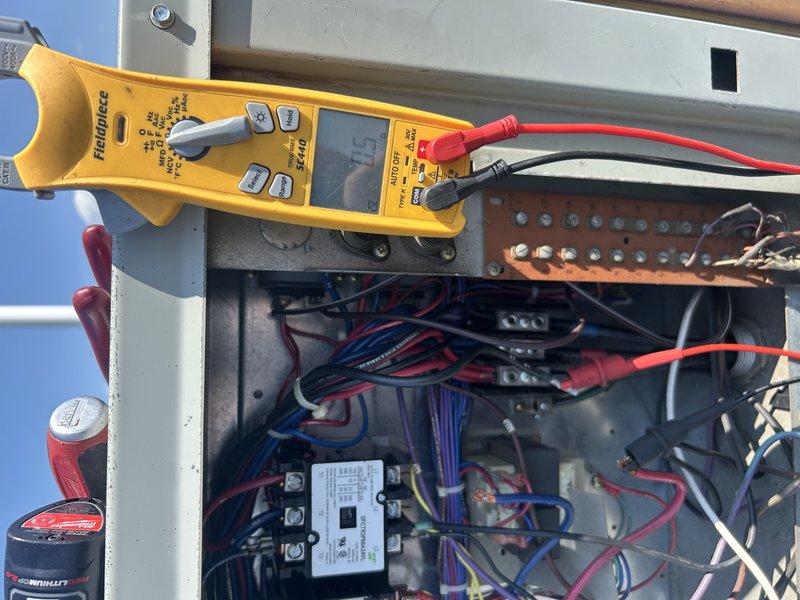 Responded to commercial RTU service call to restore cooling operation. Upon arrival, replaced blown fuses and performed comprehensive electrical diagnostics, discovering 0.8 megohm resistance from compressor black leg to ground while other legs showed open line readings. Installed new fuses and energized unit successfully. Unit initially cycled on high head pressure, requiring thorough condenser coil cleaning to resolve the issue. After coil cleaning, unit operated within normal parameters. Checked both refrigerant circuits with gauge set, confirming proper operating pressures and adequate R22 charge levels with no refrigerant addition required. Both circuits running as designed with stable operation achieved.
