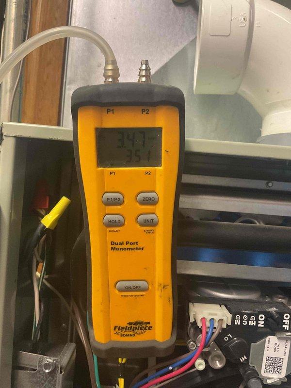 Completed seasonal heating maintenance tune-up and addressed system issues including thermostat remote requiring double-button press to open vent, which was a new development since previous service visit. Replaced failed dual capacitor and repaired thermostat wiring per approved quote. Performed comprehensive system diagnostics using manometer to verify proper pressure differentials and airflow. All repairs completed successfully, system tested and operating within manufacturer specifications.