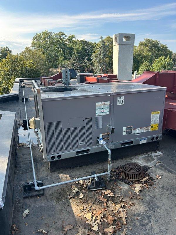Completed annual cooling maintenance visit on one rooftop unit and one dehumidifier as part of preventative maintenance agreement. Performed comprehensive AC tune-up including verification of thermostat operation, filter condition, blower assembly, outdoor coil, electrical components, condensate drain, refrigerant performance, and temperature split. Changed and cleaned filters on RTU. All operational readings measured within normal range with no mechanical defects or safety concerns identified at time of service.

Inspection revealed outdoor condenser coil heavily clogged with accumulated dirt, dust, and debris significantly restricting airflow through coil fins. Documented coil condition and recommended thorough coil cleaning to restore proper heat transfer efficiency and system performance. System confirmed operational but outdoor coil cleaning strongly advised to maintain optimal cooling capacity and prevent premature component failure. Recommended maintaining regular filter changes