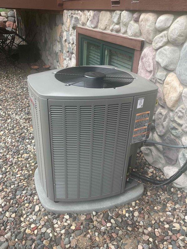 Responded to complaint of intermittent loud clunking noise from outdoor condensing unit during startup on brand new Lennox air conditioning system under warranty. Customer reported noise occasionally occurring around 10pm, described as severe enough to wake occupants. Upon arrival, performed thorough inspection and operational testing of condensing unit and indoor air handler. Ran multiple startup cycles attempting to duplicate reported noise but was unable to replicate the issue during service visit. Inspected fan blade assembly, motor mounts, compressor mounting, and all mechanical components for loose hardware, debris, or signs of abnormal wear. All components appeared secure and properly installed. As a preventative measure to address potential hard start issues that could contribute to startup noise, installed hard start capacitor kit on compressor. Advised customer to contact for return visit if noise recurs and requested video documentation of the issue to assist with diagnosis,