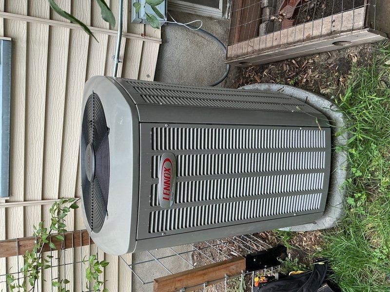 Completed annual cooling maintenance on Lennox HVAC system less than one year old. Investigated customer concern regarding intermittent warm air blowing through vents in home addition and furnace heating unexpectedly even with thermostat unplugged. Discovered air exchanger was not properly integrated with thermostat control system and was causing unwanted air circulation. Disconnected air exchanger from operation to resolve issue. Verified air conditioning system operating properly with 19-degree temperature differential across coil at time of departure. Confirmed thermostat not set to schedule mode and fan setting not in continuous "on" position. Advised customer to document any future occurrences of warm air activation with photos or video for further diagnostic evaluation if issue persists.