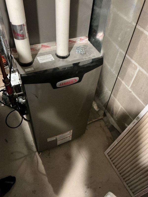 Completed annual cooling maintenance on Lennox HVAC system less than one year old. Investigated customer concern regarding intermittent warm air blowing through vents in home addition and furnace heating unexpectedly even with thermostat unplugged. Discovered air exchanger was not properly integrated with thermostat control system and was causing unwanted air circulation. Disconnected air exchanger from operation to resolve issue. Verified air conditioning system operating properly with 19-degree temperature differential across coil at time of departure. Confirmed thermostat not set to schedule mode and fan setting not in continuous "on" position. Advised customer to document any future occurrences of warm air activation with photos or video for further diagnostic evaluation if issue persists.