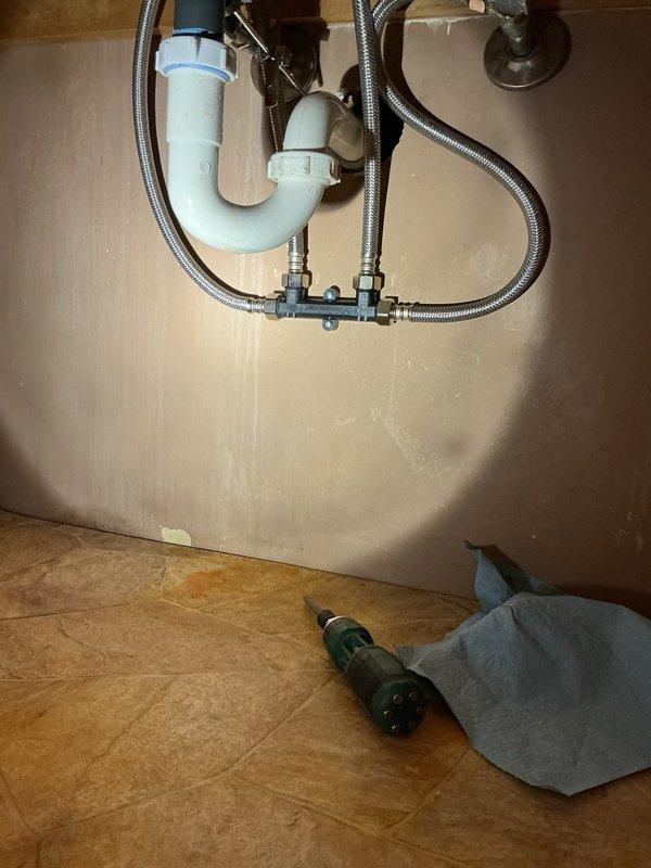 Installed comfort tee and recirculation pump system on tankless water heater to enable hot water circulation throughout the residence. Replaced T-fitting inside the boiler system to accommodate the new recirculator configuration. Installed closet flange for downstairs toilet, securing it properly to the subfloor, and noted that a 10-inch rough-in toilet may be required for proper fit in that bathroom. Tested recirculation system for proper operation and confirmed all components functioning correctly.
