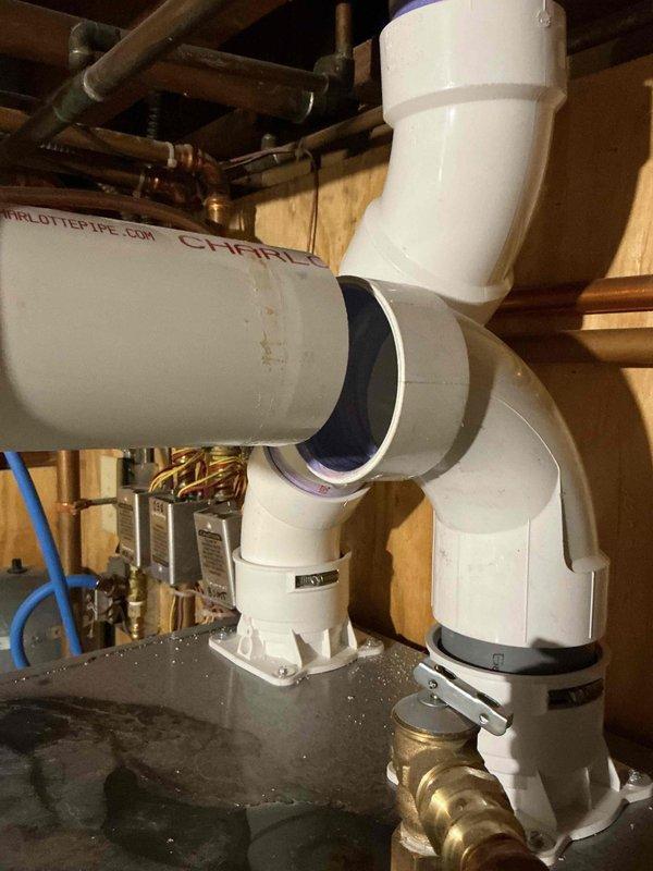Responded to callback for boiler installed in January experiencing intermittent disconnection of large exhaust pipe above unit. Upon inspection, discovered the flue connection pipe was not properly glued during initial installation, causing the pipe to come loose and leak. Applied proper PVC cement to secure the flue connection and tested system for proper operation and seal integrity.