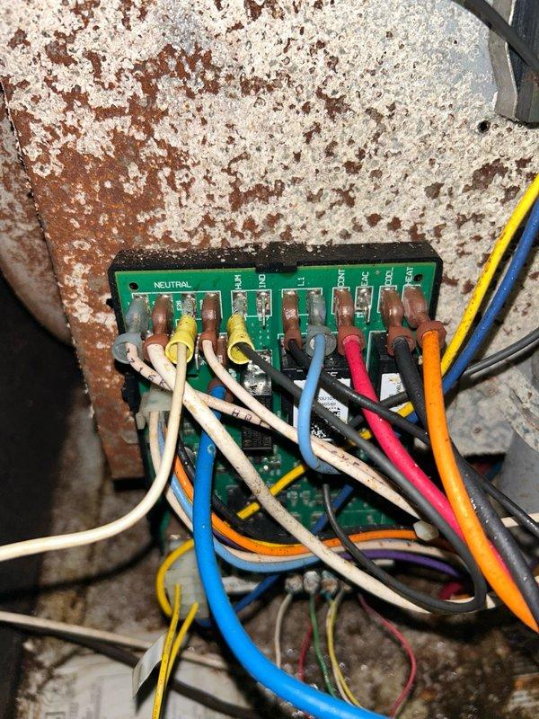 Completed return visit to install furnace ignition control board single stage. Identified and replaced moisture-damaged wiring connections showing signs of corrosion and water exposure on terminal block and mounting surface. Restored power to system and verified proper operation of heating components.

Performed comprehensive inspection of outdoor condensing unit. Removed rodent nest from equipment and verified electrical components including capacitor and contactor were functioning within specifications. Measured system amperage at 94.1 amps using clamp meter. Evaluated refrigeration system performance and confirmed adequate cooling with proper supply air temperatures. Noted metering device showing irregular operation but system maintaining acceptable cooling performance at time of service. All repaired systems tested and operational upon departure.