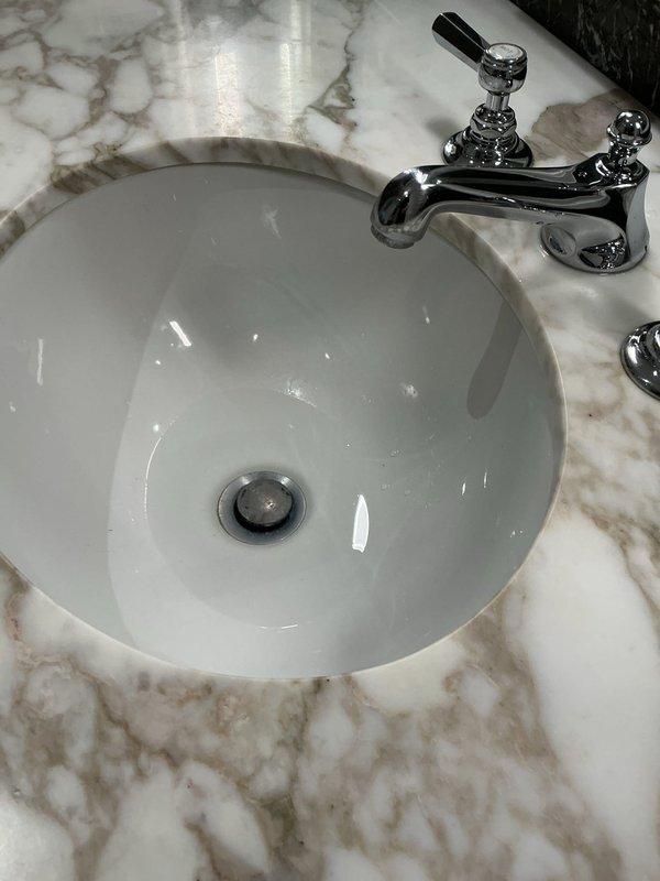 Responded to master bathroom double vanity with clogged drain on right side and intermittent leaking from both faucets. Removed and replaced both wide spread faucets, making proper connections to supply lines. Cleared hair blockage from affected drain line. Tested both faucet assemblies for proper operation and verified no leaks present upon completion.
