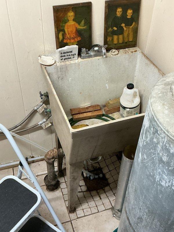 Responded to a slow-draining kitchen sink in a home with original 1970 cast iron plumbing. Upon inspection, identified a partial clog caused by significant grease buildup in the drain line. Successfully snaked the kitchen sink drain using a rigid drain machine, extracting large amounts of accumulated grease and restoring proper drainage flow.
