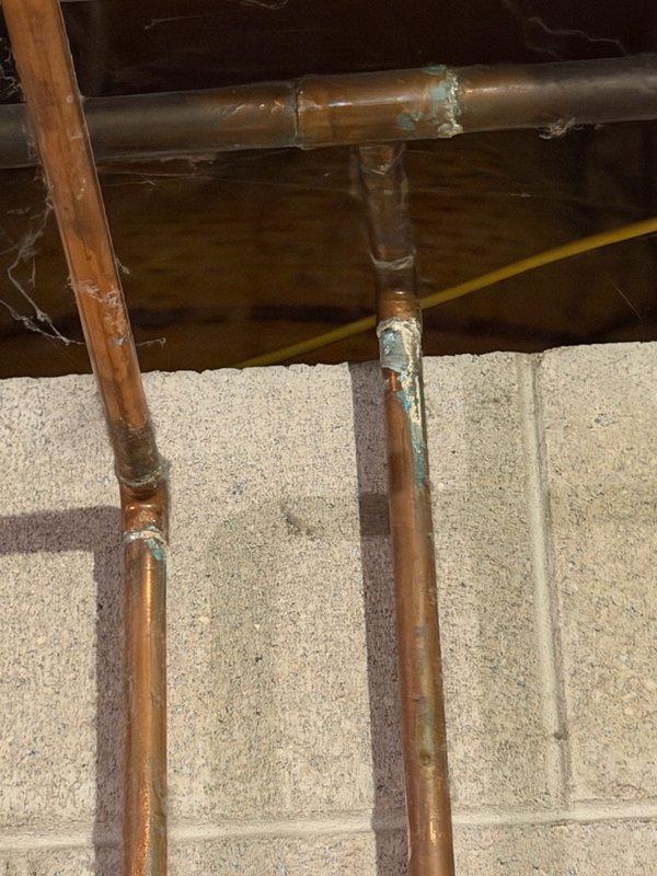 Completed comprehensive Family Rewards plumbing inspection of residential property. Inspected copper supply lines in attic space and basement plumbing system, including water supply piping, drainage components, and fixtures. Identified multiple items requiring attention: supply stops showing wear and requiring replacement, drain assembly in need of service, and toilet requiring replacement. Documented conditions with photographs of copper piping showing oxidation and patina, basement plumbing configuration with supply lines and drainage system. Prepared and submitted detailed estimates for recommended repairs and replacements to bring plumbing system up to optimal operating condition.