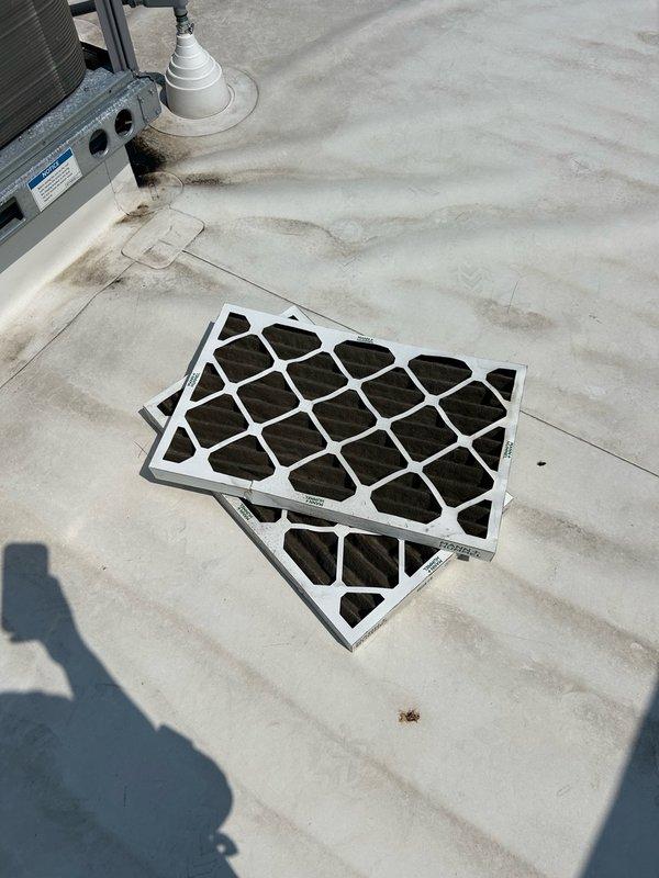 Completed annual cooling maintenance visit on multiple commercial rooftop units at two locations. Performed cooling and fan operation checks on three Carrier RTU systems, replaced all return air filters with 16x16x2 filters, and cleaned condenser coils on all serviced units. Building was unoccupied with no access to thermostats, but all exterior maintenance tasks including filter replacement and coil cleaning were successfully completed on four rooftop units total.