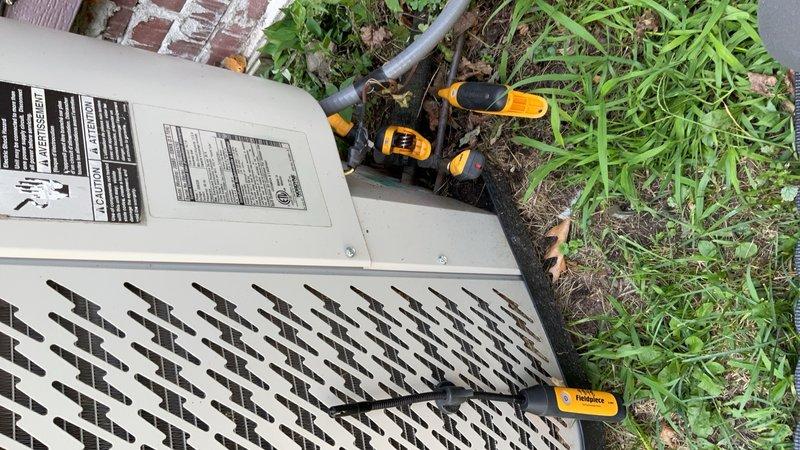 Responded to no-cool complaint on 2014 Nordyne R-22 air conditioning system at rental property. Tenant reported severe suction line icing with water intrusion into furnace cabinet. Upon arrival, system had been off approximately 12 hours per previous instruction. Conducted pressure diagnostics revealing equalized standing pressure of 59 psig on both suction and liquid lines with 85°F outdoor ambient temperature, confirming system is substantially undercharged. Visual inspection confirmed previous ice formation on suction line and water damage to furnace area. Pressure readings indicate significant refrigerant leak in sealed refrigerant circuit. Per company policy, no leak search, coil repair, or R-22 recharge was performed on this aging system. Advised property owner that system requires either complete leak repair with refrigerant circuit restoration or full equipment replacement to restore cooling operation.