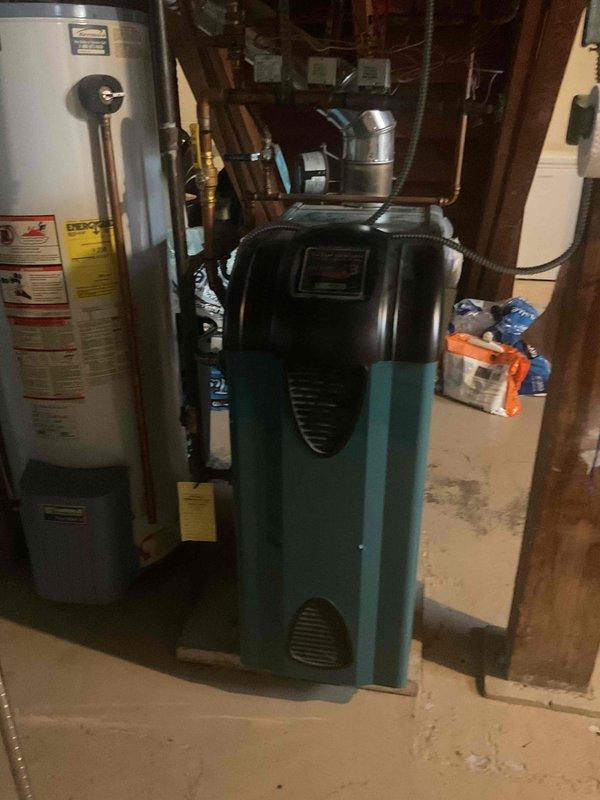 Responded to no-heat call for 15-year-old zoned heating system where upstairs zone was functioning but downstairs zone had no heat. Inspected basement mechanical room containing furnace and water heater equipment, examined ductwork connections, and assessed system components after previous service attempts by another company had failed to resolve the issue. Scheduled follow-up appointment to complete diagnostic testing and necessary repairs to restore heat to affected zone.