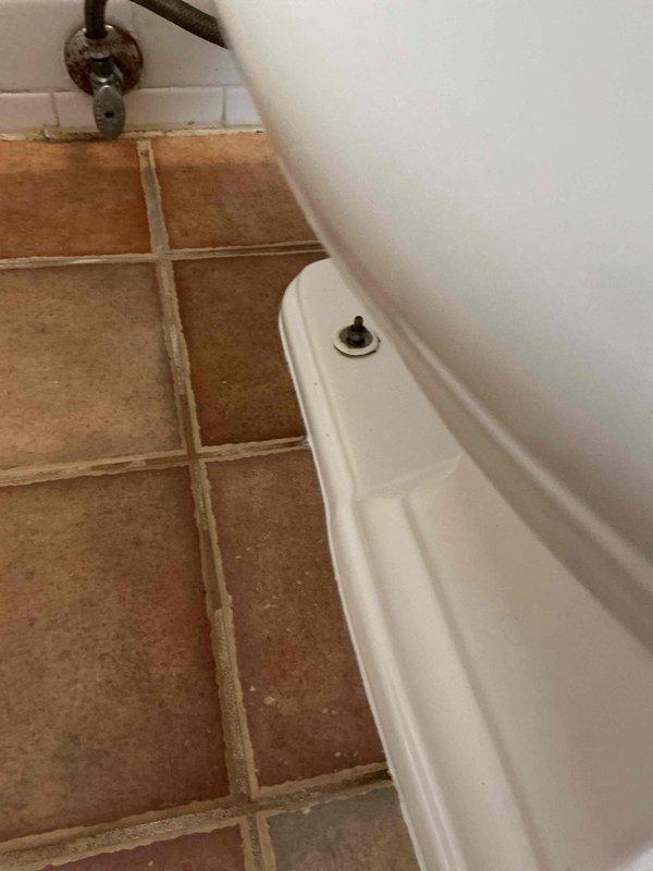 Responded to dispatch for toilet leaking at base. Diagnosed failed wax ring seal causing water discharge onto bathroom floor. Pulled toilet from flange, removed deteriorated wax ring, cleaned flange and toilet base, installed new wax ring, reset toilet, and tested for proper seal and operation with no leaks detected.