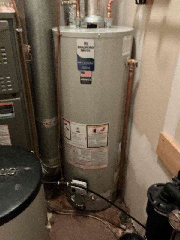 Responded to dispatch for toilet leaking at base. Diagnosed failed wax ring seal causing water discharge onto bathroom floor. Pulled toilet from flange, removed deteriorated wax ring, cleaned flange and toilet base, installed new wax ring, reset toilet, and tested for proper seal and operation with no leaks detected.