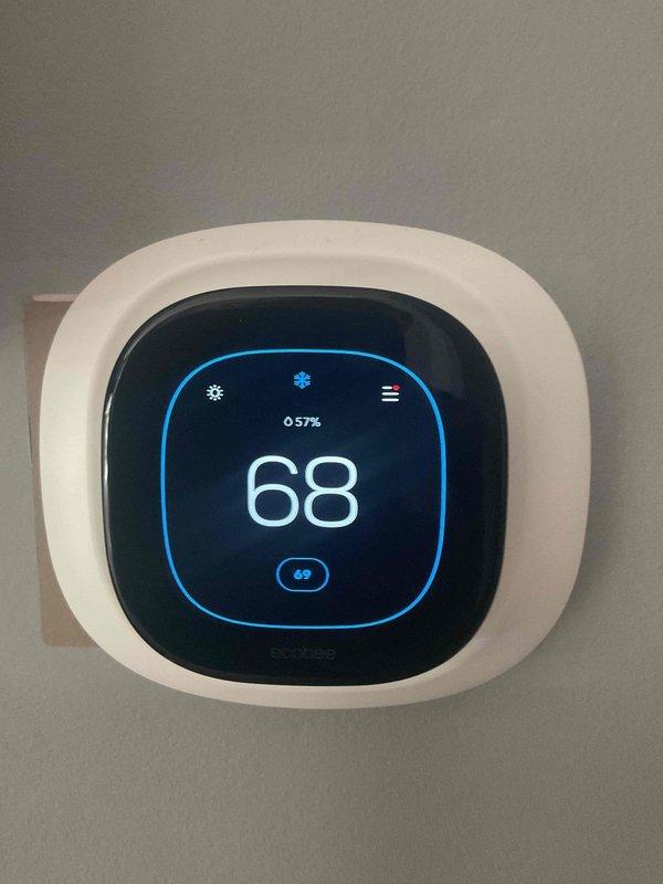 Responded to service call regarding elevated humidity levels and dampness concerns in home with reports of warping floors. Upon arrival, performed comprehensive indoor air quality assessment and humidity evaluation. Inspected Carrier HVAC system and measured relative humidity levels using calibrated instruments. Found humidity readings within acceptable range at 57%, indicating no mechanical issues with the system's humidity control. Identified heavily soiled air filter as contributing factor to reduced air circulation and customer comfort concerns. Replaced dirty filter with new Filtrete 16x25x4 pleated media filter to restore proper airflow and system efficiency. Verified thermostat operation and settings on digital control unit, confirming proper system function at 68°F setpoint. Educated customer on acceptable indoor humidity ranges and recommended monitoring conditions following filter replacement to ensure improved air circulation addresses comfort concerns.