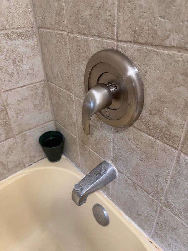 Responded to service call for broken shower handle. Upon inspection, determined the shower cartridge required replacement. Successfully removed the failed cartridge and installed customer-supplied replacement cartridge. Tested the shower valve control handle for proper operation, confirming smooth lever movement and appropriate water flow control. All fixtures restored to full working condition with no leaks detected.