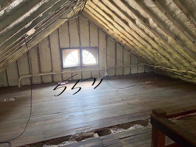 Responded to service call for water leaking from two of three mini-split head units during cooling operation on an 8-year-old system. Inspected attic space and located one accessible condensate line serving the 35-foot line set; second problematic unit on 55-foot line set has inaccessible condensate routing. Confirmed through wiring diagram review and model specifications that these units lack factory-installed condensate pumps. Determined both condensate lines currently route upward and outward through attic space, causing drainage issues. Documented conditions with photos and recommended plan to reroute condensate lines downward and exit through side of brick exterior to resolve leaking problem.