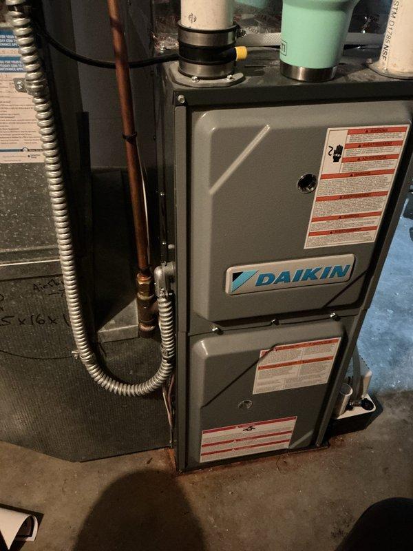 Completed annual spring cooling maintenance on 6-year-old Daikin air conditioning system. Performed comprehensive tune-up including inspection of all AC components, verification of proper operation within manufacturer specifications, refrigerant level check confirming adequate charge, and cleaning of outdoor condenser coil. All system components tested and found functioning correctly. Provided estimate for electronic air cleaner installation as an optional upgrade to improve indoor air quality.