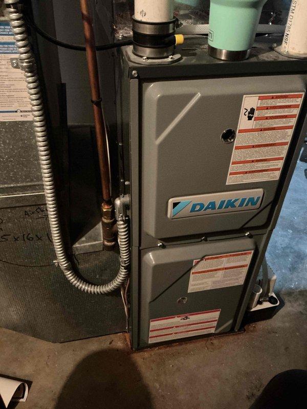Completed annual spring cooling maintenance on 6-year-old Daikin air conditioning system. Performed comprehensive tune-up including inspection of all AC components, verification of proper operation within manufacturer specifications, refrigerant level check confirming adequate charge, and cleaning of outdoor condenser coil. All system components tested and found functioning correctly. Provided estimate for electronic air cleaner installation as an optional upgrade to improve indoor air quality.