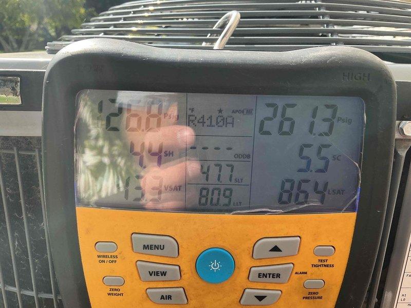 Responded to no-cool service call on 7-year-old central air conditioning system. Outdoor unit was not turning on and periodically buzzing but failing to start, with indoor unit blowing ambient temperature air. Diagnosed failed capacitor as root cause preventing compressor startup. Replaced defective capacitor and performed comprehensive system testing using diagnostic equipment. Verified all components operating within manufacturer specifications, confirmed proper refrigerant charge levels and pressures, and tested system performance. Unit restored to full operational status with normal cooling capacity.