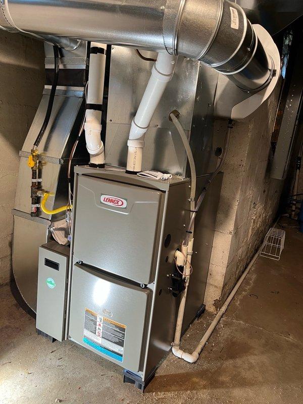 Performed comprehensive AC tune-up on 5-year-old Lennox system. Inspected blower assembly, found clean and balanced; evaporator coil clean with proper drainage. Discovered humidifier incorrectly set to on position and damper in winter position, adjusted both to summer settings. Conducted electrical inspection on outdoor unit, all readings within manufacturer specifications. Replaced air filter per customer request. System tested and operational with 20-degree temperature differential across coil, confirming proper cooling performance.