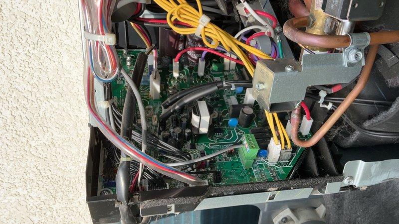 Replaced failed inverter control board on Daikin mini-split outdoor unit under parts and labor warranty. Disassembled control panel housing, removed defective PCB, and installed new inverter board. Set thermostat to test mode to verify proper communication between indoor and outdoor units. Conducted operational testing confirming outdoor unit functionality and measured 20-degree delta-t across the system, indicating proper cooling performance. System restored to full operation with all components functioning within normal parameters.