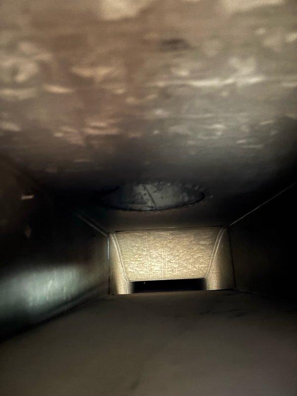 Completed comprehensive duct cleaning service addressing significant dust and lint accumulation throughout the HVAC system. Cleaned and serviced 15 openings including both supply and return ducts, removing heavy debris buildup and discoloration from interior duct surfaces. All vents were thoroughly cleaned and cleared to restore proper airflow and system efficiency.