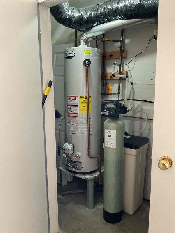 Responded to no hot water call with reported pilot light outage and gas odor. Upon inspection, diagnosed failed gas valve on A.O. Smith tanked water heater preventing pilot ignition. Provided customer with repair versus replacement options given the nature of the gas valve failure and overall system condition.