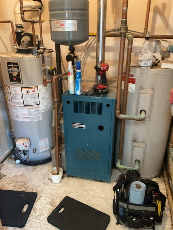 Completed comprehensive boiler tune-up including cleaning burners and flame sensor, and vacuuming debris from unit bottom. Diagnosed and replaced malfunctioning circulation pump serving bedroom zone due to pump failure. System tested and verified operational upon completion.