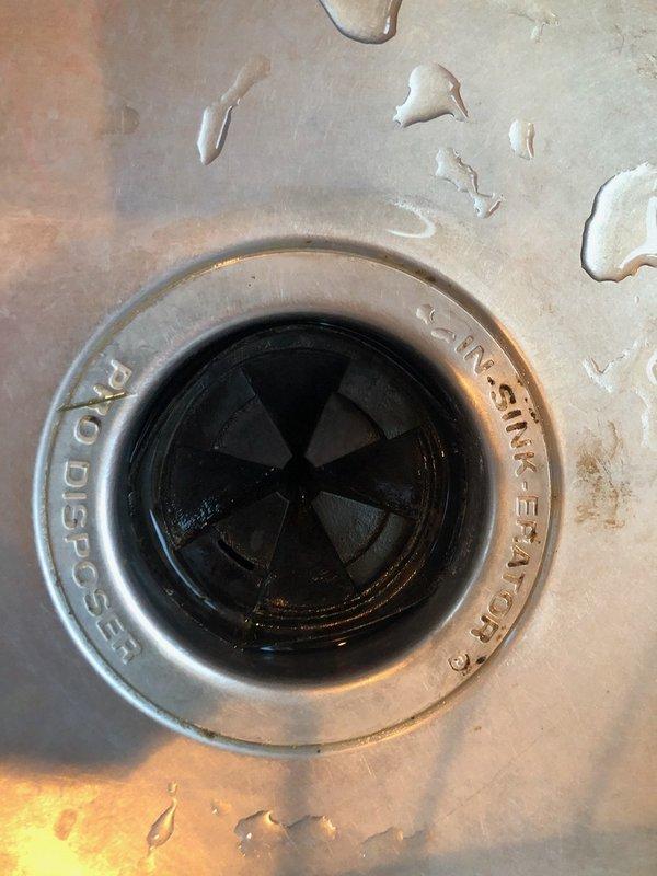 Responded to service call for malfunctioning garbage disposal unit. Upon inspection, found one cutting knife jammed, causing reduced performance. Presented repair option to customer, who opted for full unit replacement. Removed existing disposal and installed new InSinkErator Pro Disposer 3/4 HP unit with electrical cord. Secured mounting assembly to sink drain opening, verified all connections, and tested operational functionality. Confirmed proper grinding performance and inspected all plumbing connections for leaks with no issues detected.