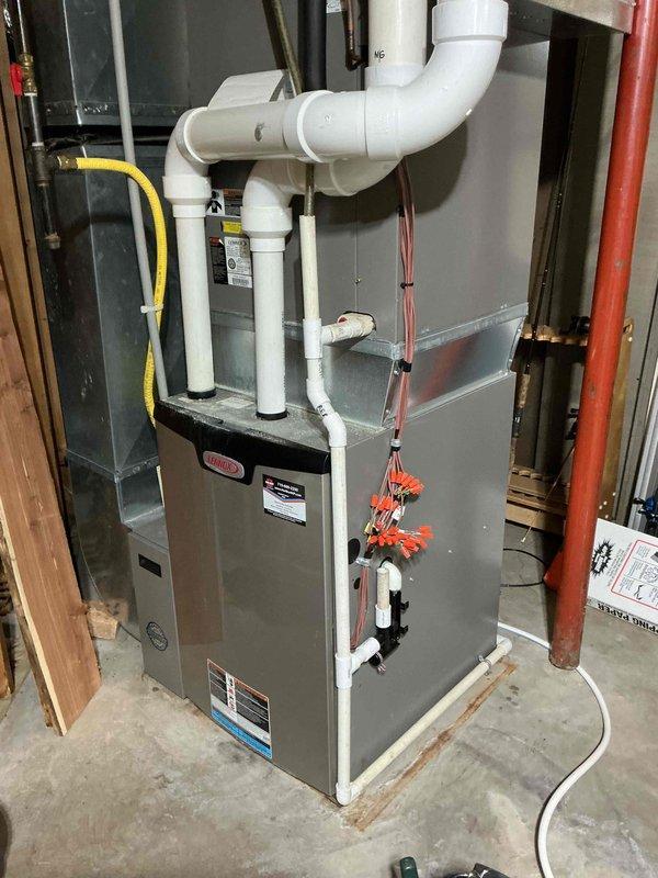 Completed annual maintenance on both furnace and air conditioning systems. Performed comprehensive inspection and testing of all electrical components on both units, confirming all readings were within manufacturer specifications. Verified air filter had been recently changed and inspected blower wheel, which was found to be clean. Tested furnace operation with successful startup and confirmed proper heating performance with 50-degree temperature rise across heat exchanger.

Proceeded to air conditioning system and removed access panels for inspection. Cleaned condensate drain line and discovered bee nests within unit, which were removed and area cleaned thoroughly. Verified all electrical connections and components were secure and functioning properly. Confirmed evaporator coil drain line was draining correctly without blockages. Started air conditioning system and verified proper operation with 20-degree temperature drop across evaporator coil, indicating adequate refrigerant charge 