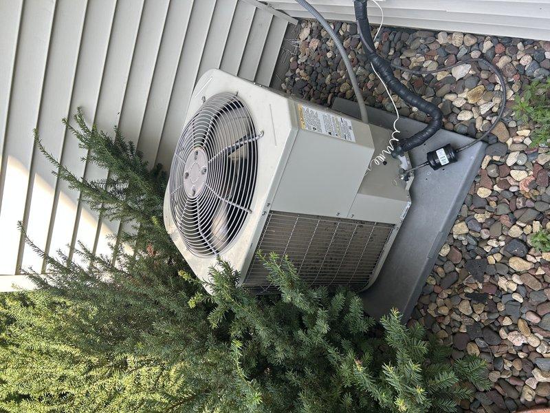 Performed comprehensive air conditioning tuneup and system evaluation. Tested AC operation and replaced air filter. Inspected furnace blower compartment for proper function. Cleaned condenser coil by washing exterior unit and removing accumulated debris. After allowing system to run for 20 minutes, connected manifold gauges to assess refrigerant charge. System diagnostics revealed TXV system operating with only 1° subcooling, indicating refrigerant charge is below optimal levels. Unit currently providing adequate cooling but performance would improve with proper refrigerant charge. Provided recommendations for refrigerant service to restore system to manufacturer specifications for optimal efficiency and longevity.
