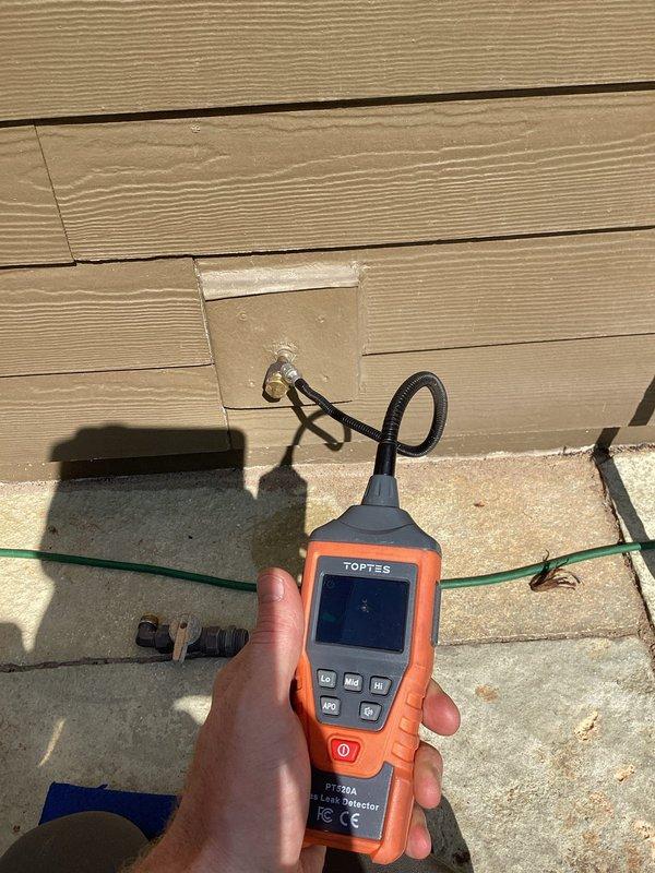 Responded to service call for outdoor gas line requiring capping to prevent accidental opening. Upon arrival, confirmed line was not actively leaking but valve could be easily opened, presenting a potential safety hazard. Successfully capped the gas line and performed pressure testing to verify integrity of the repair. Leak detection equipment confirmed no gas leakage present after completion of work.