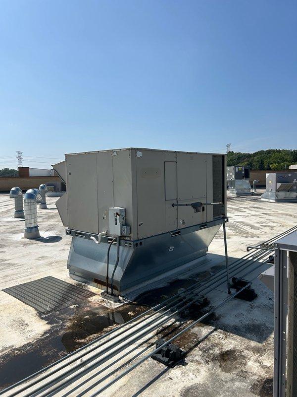 Completed annual cooling maintenance on three commercial rooftop units. Replaced all return air filters (4 ea. 18x24x2 and 8 ea. 16x16x2), cleaned condenser coils with water, cleared condensation drain lines, and inspected compressor and condenser fan motors. All units operating normally with proper cooling function verified; no issues found.