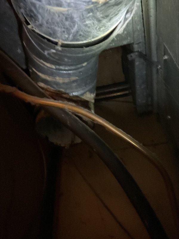 Responded to inspection correction for failed water heater venting system. Removed deteriorated 6-inch B-vent tee that had rusted through, compromising proper exhaust ventilation. Procured replacement components and installed new B-vent tee with proper cap to restore safe venting operation. All work completed in confined attic space with existing copper plumbing and HVAC ductwork present. System tested and verified for proper draft and secure connections upon completion.