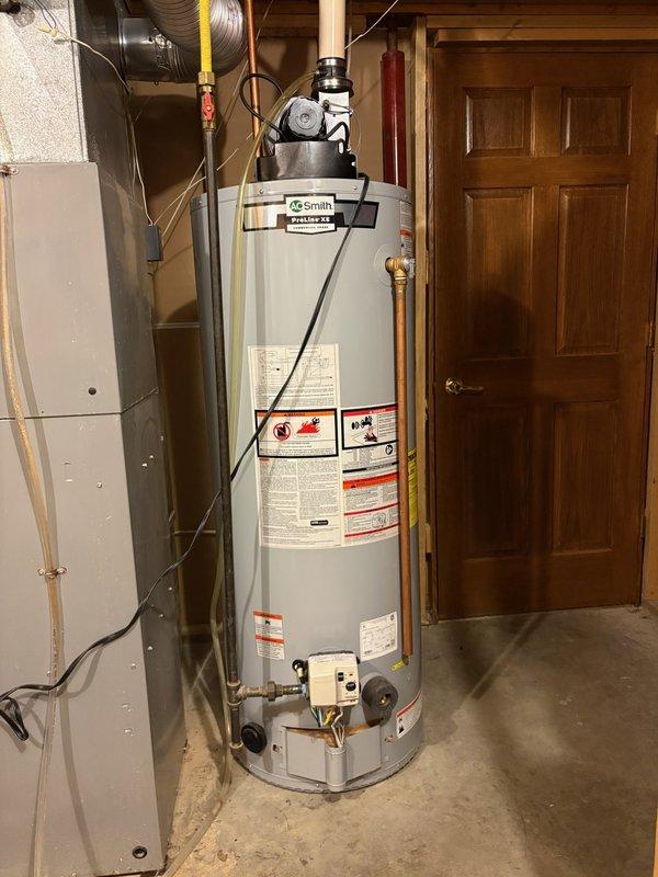Responded to no hot water complaint on A.O. Smith tanked water heater. Upon arrival, confirmed unit was not producing hot water. Control board displayed 3-flash error code indicating TCO or pressure switch failure in open position. Attempted reset and observed blower motor startup, but ignition sequence failed to initiate. Unit cycled through attempted ignition 3-4 times before shutting down, confirming communication failure between blower assembly and control board. Diagnosed blower motor assembly malfunction preventing proper signal transmission to ignition system. Documented equipment condition with photos and provided customer with repair options and cost estimates for blower motor replacement and associated components to restore proper operation.