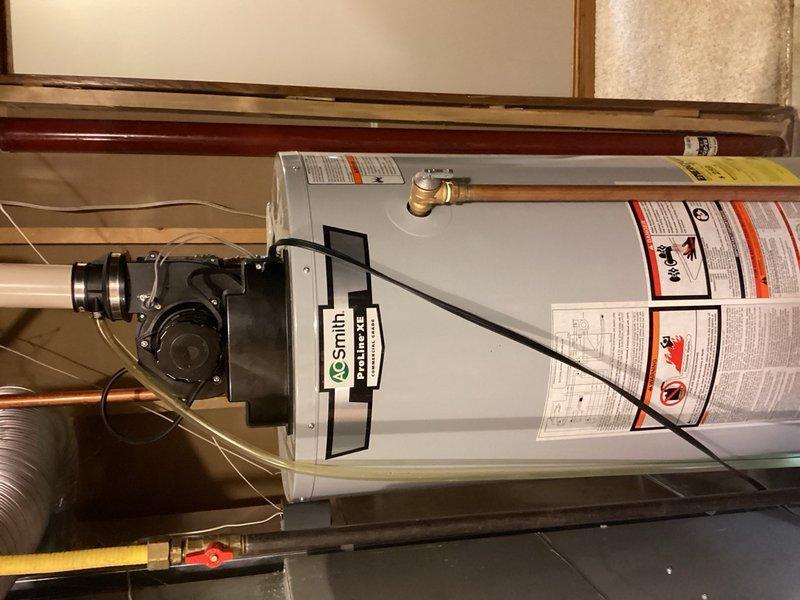 Responded to no hot water complaint on A.O. Smith tanked water heater. Upon arrival, confirmed unit was not producing hot water. Control board displayed 3-flash error code indicating TCO or pressure switch failure in open position. Attempted reset and observed blower motor startup, but ignition sequence failed to initiate. Unit cycled through attempted ignition 3-4 times before shutting down, confirming communication failure between blower assembly and control board. Diagnosed blower motor assembly malfunction preventing proper signal transmission to ignition system. Documented equipment condition with photos and provided customer with repair options and cost estimates for blower motor replacement and associated components to restore proper operation.