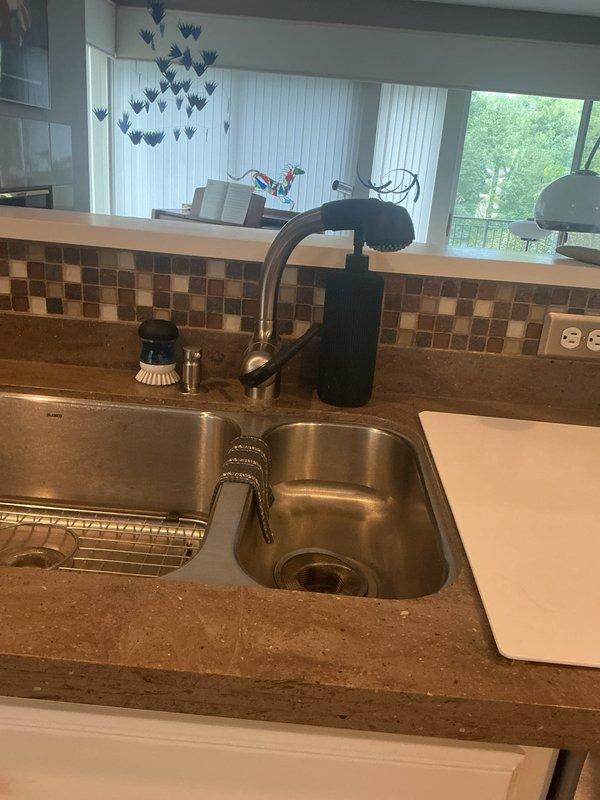 Responded to water leak service call at residential property. Installed customer-provided factory braided supply hose at kitchen sink faucet. Contacted customer en route to confirm arrival time, then returned to complete installation. Verified proper connection and tested for leaks to ensure system integrity.